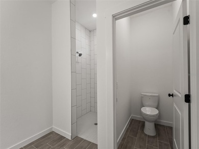 Virtually Staged. Tile throughout. Quartz countertops. Impact - photo 23