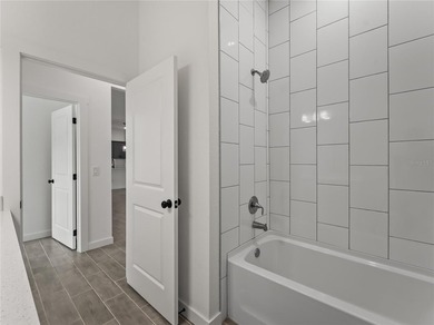 Virtually Staged. Tile throughout. Quartz countertops. Impact - photo 29
