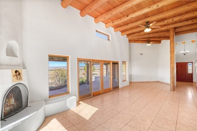 24 Hunter Drive is a pueblo style home in the Vista de Pedernal
