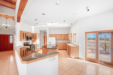 24 Hunter Drive is a pueblo style home in the Vista de Pedernal