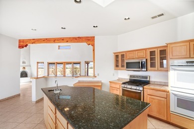 24 Hunter Drive is a pueblo style home in the Vista de Pedernal