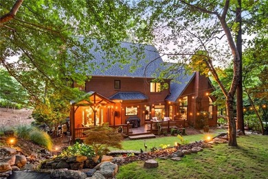 Nestled beneath a canopy of mature hardwoods on a quiet - photo 2