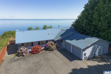 Perched on a high-bank overlooking the waterfront, this property - photo 1