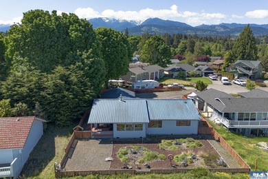 Perched on a high-bank overlooking the waterfront, this property - photo 3