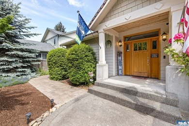Tucked beyond a paved driveway and framed by crosswood fencing - photo 1