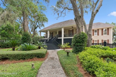 Experience exceptional deep-water waterfront living on the - photo 1