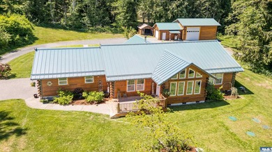 Tucked away on 4.7 beautiful acres, this stunning log home - photo 1