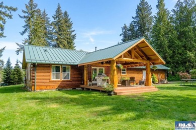 Tucked away on 4.7 beautiful acres, this stunning log home - photo 2