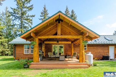 Tucked away on 4.7 beautiful acres, this stunning log home - photo 3