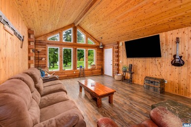 Tucked away on 4.7 beautiful acres, this stunning log home - photo 9