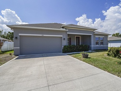 LIKE NEW beautiful 2022 built concrete block home located in the - photo 1