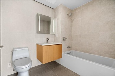 Residence 6E at Bayview Courtyard offers a serene waterfront - photo 9