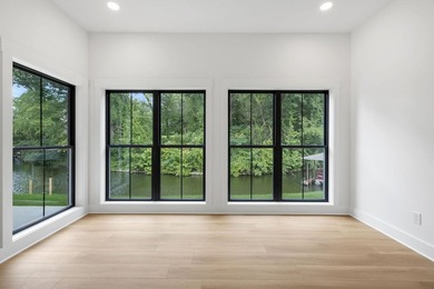 This new construction modern lake home is so fresh the walls - photo 15