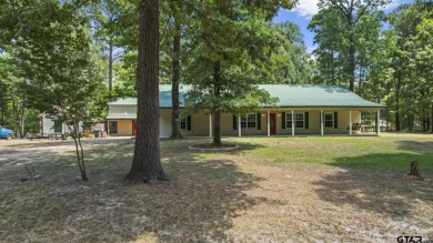 Enjoy lakeside living in this 3-bedroom, 2-bath home in the - Lake Home For Sale in Scroggins, Texas