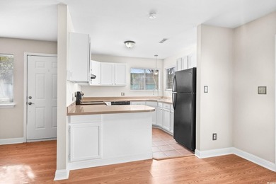 This charming three-bedroom, two-bathroom patio home is located - photo 10