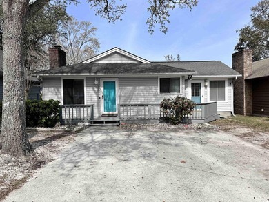 Live just half a mile from the beach, this charming patio home - photo 1