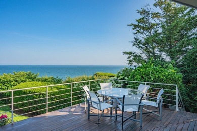 Set high on a scenic bluff in New Seabury, this contemporary - photo 4
