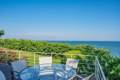 Set high on a scenic bluff in New Seabury, this contemporary - photo 5