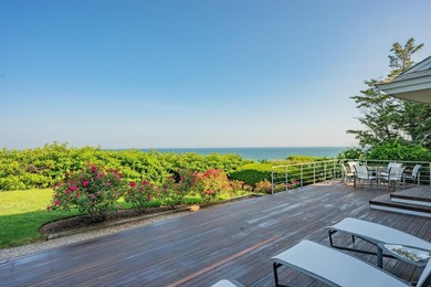 Set high on a scenic bluff in New Seabury, this contemporary - photo 6