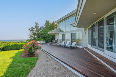 Set high on a scenic bluff in New Seabury, this contemporary - photo 7