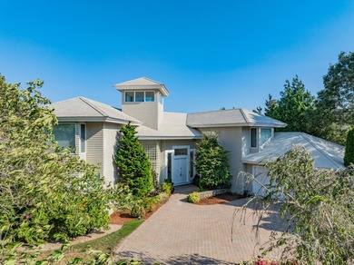 Set high on a scenic bluff in New Seabury, this contemporary - photo 9