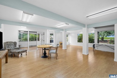 Panoramic golf-course views anchor this light-filled two-story - photo 8