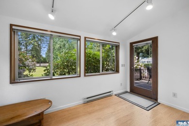 Panoramic golf-course views anchor this light-filled two-story - photo 10