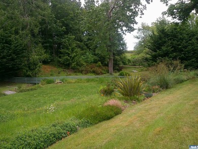Beautifully landscaped acreage with views overlooking Discovery - photo 6