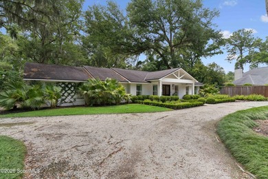 Tucked away on nearly a full acre on St. Simons Island, this - photo 3