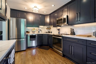 Welcome home to this bright and inviting remodeled 1st floor - photo 4