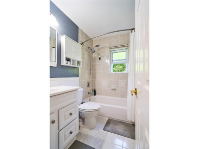 Welcome home to this bright and inviting remodeled 1st floor - photo 8
