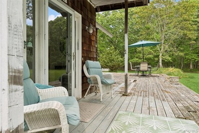 Set on a private 1.18-acre property in Hampton Bays, this - photo 5