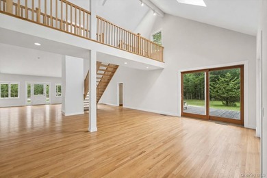 Set on a private 1.18-acre property in Hampton Bays, this - photo 8