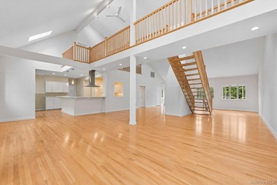 Set on a private 1.18-acre property in Hampton Bays, this - photo 9