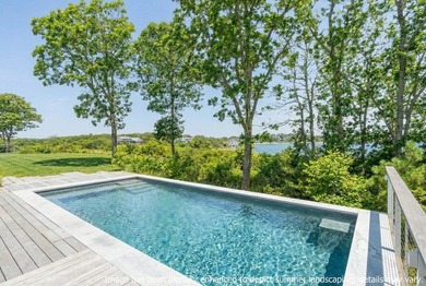 Nestled above the shimmering waters of Bassing Harbor, this - photo 3