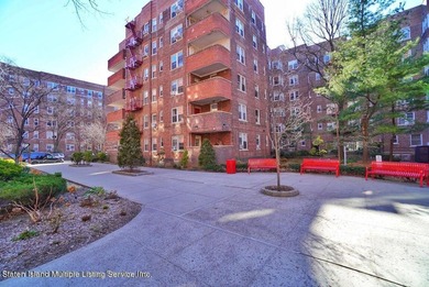 LOCATED IN THE HEART OF MIDWOOD, ON A BEAUTIFUL TREE-LINED