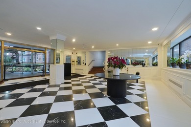 LOCATED IN THE HEART OF MIDWOOD, ON A BEAUTIFUL TREE-LINED