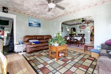 HURRY!! This three-bedroom, two-bath home sits on an oversized