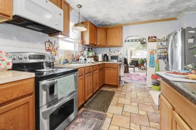 HURRY!! This three-bedroom, two-bath home sits on an oversized