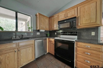 Nestled on a quiet street, this inviting residence blends - photo 15