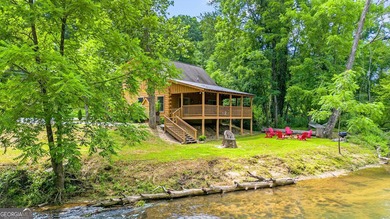 This beautiful log cabin home is located on the edge of the - photo 2