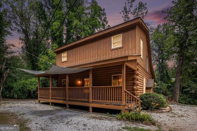 This beautiful log cabin home is located on the edge of the - photo 3