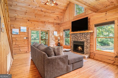 This beautiful log cabin home is located on the edge of the - photo 5