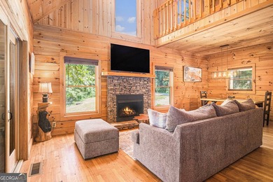 This beautiful log cabin home is located on the edge of the - photo 6