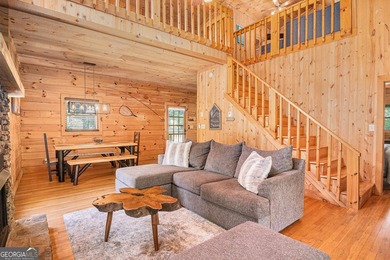 This beautiful log cabin home is located on the edge of the - photo 7