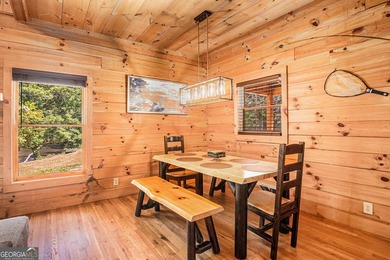 This beautiful log cabin home is located on the edge of the - photo 8