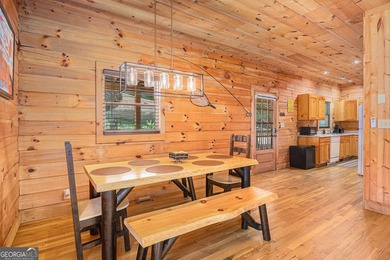 This beautiful log cabin home is located on the edge of the - photo 9