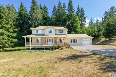 Tucked into a peaceful setting, this spacious 4-bedroom, 2 - photo 1
