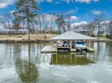 Escape to the tranquility of lakeside living with this charming - Lake Home Sale Pending in Chandler, Texas