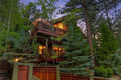 Perched among the trees in sought-after Moonridge, this - photo 1